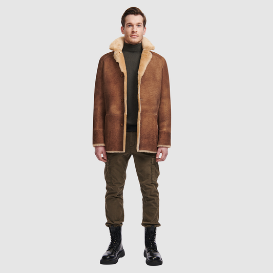 Reversible shearling relaxed fitting suede coat Reverses to iron wool teddy  Drop shoulder When worn wool in, fitted on the shoulders and chest, straight cut through the torso When worn wool out, relaxed fit through the shoulder and body Notch collar Raw edge finish Single breasted 3 button closure Slash side pockets on both suede side and reversed iron wool side 