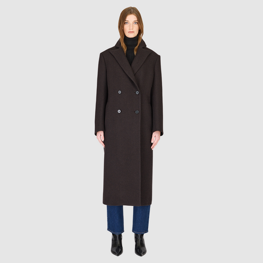The KENNEDY Brown Herringbone Wool Coat delivers timeless tailoring in a superfine Italian wool blend. Its double-breasted silhouette is structured through the shoulders and arms with relaxed ease through the torso, creating a refined, modern fit. A classic spread collar and back vent enhance the polished silhouette, while subtle welt pockets add functional elegance. Designed for versatile wear, KENNEDY is a luxurious staple for any sophisticated outerwear collection.