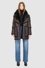 The LUREEN Coat is a luxury reversible semi-suede outerwear piece crafted in Java Toscana. Designed to flip seamlessly from smooth semi-suede to plush Toscana wool teddy, it offers versatile styling for cold-weather layering. The wool-out Toscana seam detailing on the semi-suede side, combined with a drop shoulder and relaxed fit through shoulders, arms, and torso, creates effortless volume and structure. An oversized Toscana notch collar, patch pockets on both sides, and a front button closure.