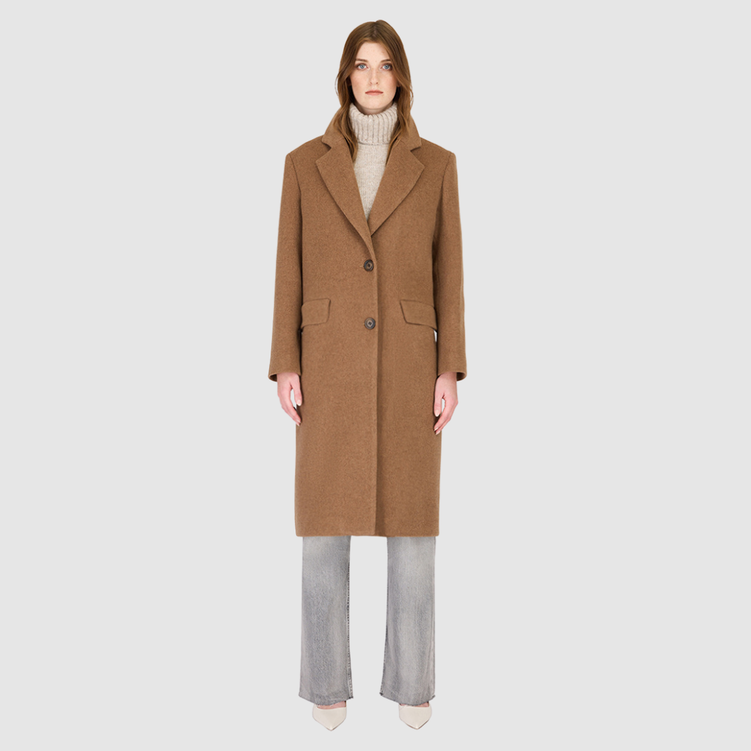 The Paisley Camel Melange Wool Cashmere Coat is crafted from a luxurious Italian wool cashmere blend, tailored in a single-breasted silhouette that channels modern refinement with a masculine-inspired edge. Featuring regular shoulders, a structured notch collar, and a straight fit through the body, it balances clean lines with effortless versatility. Finished with a back vent and single welt flap pockets, this coat offers both timeless sophistication and everyday functionality.