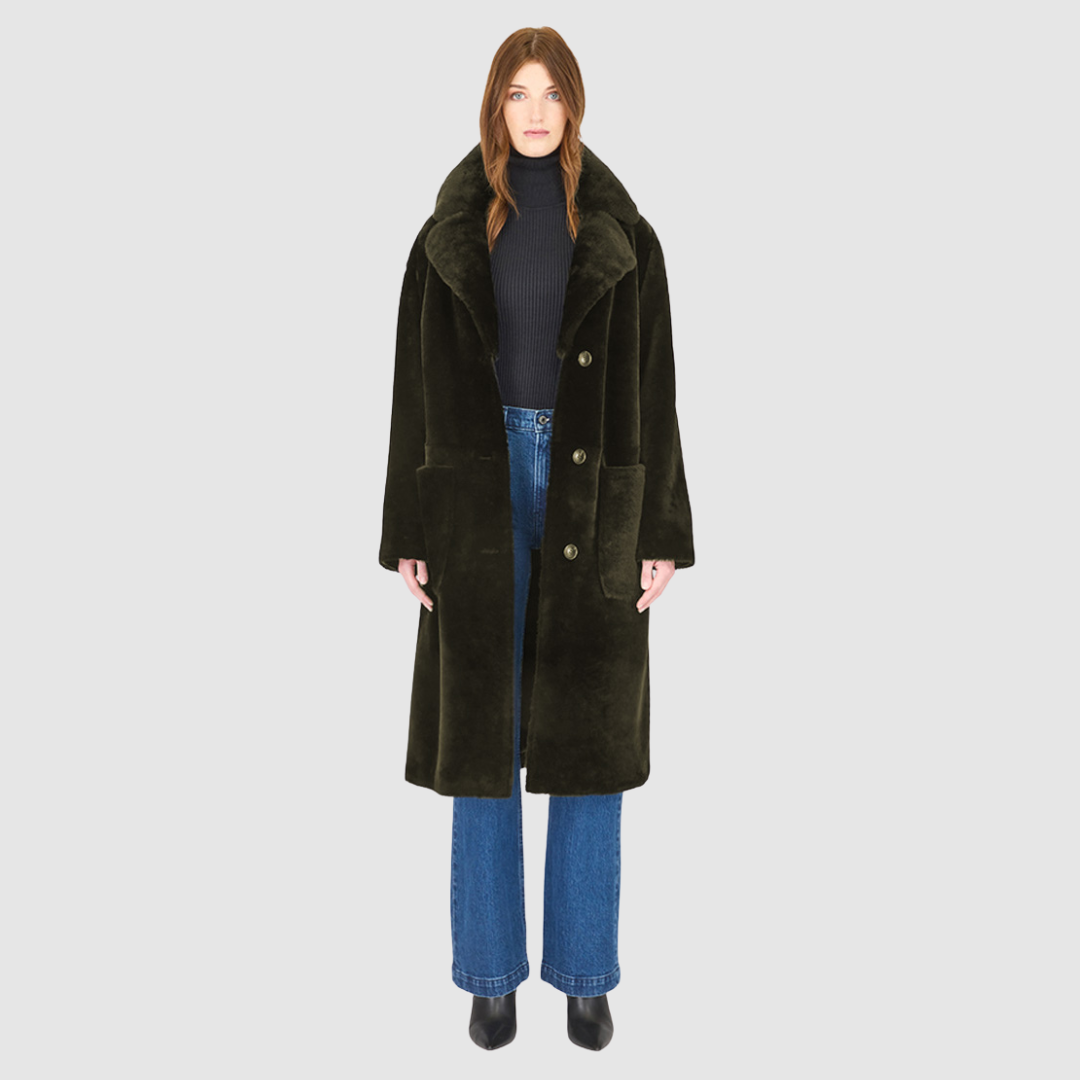 The PRADO Coat is a luxury vintage-inspired wool teddy coat crafted from khaki ironed wool for a textured, modern finish. Designed with a relaxed dropped shoulder and tie belt at the waist, it combines effortless comfort with a flattering, cinched silhouette. A notch collar, large side patch pockets, and front button closure complete this statement wool teddy coat, perfect for elevated cold-weather styling.