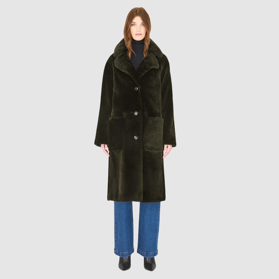 The PRADO Coat is a luxury vintage-inspired wool teddy coat crafted from khaki ironed wool for a textured, modern finish. Designed with a relaxed dropped shoulder and tie belt at the waist, it combines effortless comfort with a flattering, cinched silhouette. A notch collar, large side patch pockets, and front button closure complete this statement wool teddy coat, perfect for elevated cold-weather styling.