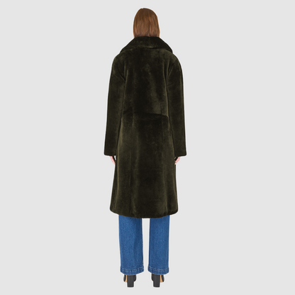 The PRADO Coat is a luxury vintage-inspired wool teddy coat crafted from khaki ironed wool for a textured, modern finish. Designed with a relaxed dropped shoulder and tie belt at the waist, it combines effortless comfort with a flattering, cinched silhouette. A notch collar, large side patch pockets, and front button closure complete this statement wool teddy coat, perfect for elevated cold-weather styling.