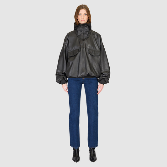 The Realm Black Leather Anorak Jacket is a modern interpretation of the classic anorak, elevated in luxury leather for a bold yet versatile statement. Designed with an oversized silhouette, it features a structured funnel neck collar and a concealed half-zip placket with gunmetal snap closures. Voluminous balloon sleeves and a cinched hem bring sculptural dimension, while functional flap pockets add everyday utility. A fusion of designer craftsmanship and contemporary outerwear design