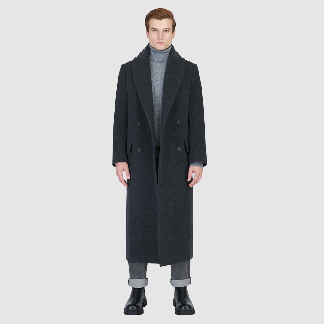 The RYDER Charcoal Coat redefines outerwear with a balance of heritage tailoring and modern ease. Crafted from an Italian wool–cashmere blend, it offers a refined drape with a double-breasted silhouette and relaxed kimono gusset sleeves. A drop shoulder and oversized notch collar add a contemporary edge, while the back vent ensures movement and comfort. Designed with timeless versatility, RYDER is a statement of understated sophistication for city wear.