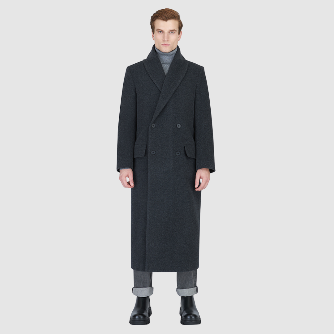 The RYDER Charcoal Coat redefines outerwear with a balance of heritage tailoring and modern ease. Crafted from an Italian wool–cashmere blend, it offers a refined drape with a double-breasted silhouette and relaxed kimono gusset sleeves. A drop shoulder and oversized notch collar add a contemporary edge, while the back vent ensures movement and comfort. Designed with timeless versatility, RYDER is a statement of understated sophistication for city wear.