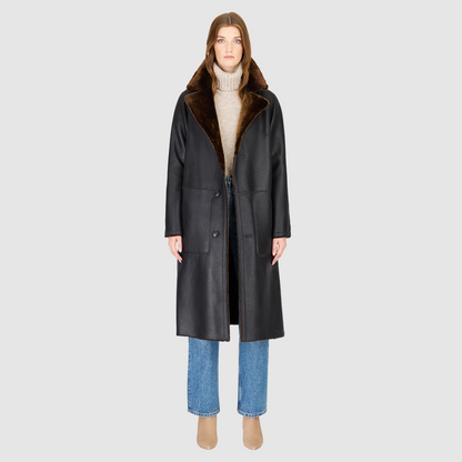 The ZIRA Coat is a heritage-inspired vintage reversible shearling jacket crafted in macassar nappa and iron wool. Designed to flip effortlessly from sleek nappa to plush iron wool teddy, it delivers versatile styling for both après-ski sophistication and everyday cold-weather elegance. Featuring a relaxed dropped shoulder, notch collar, and 3-button closure, ZIRA combines modern tailoring with timeless texture. Practical zip pockets on the nappa side and patch pockets on the teddy side, along with tie belt