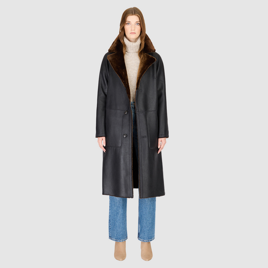 The ZIRA Coat is a heritage-inspired vintage reversible shearling jacket crafted in macassar nappa and iron wool. Designed to flip effortlessly from sleek nappa to plush iron wool teddy, it delivers versatile styling for both après-ski sophistication and everyday cold-weather elegance. Featuring a relaxed dropped shoulder, notch collar, and 3-button closure, ZIRA combines modern tailoring with timeless texture. Practical zip pockets on the nappa side and patch pockets on the teddy side, along with tie belt
