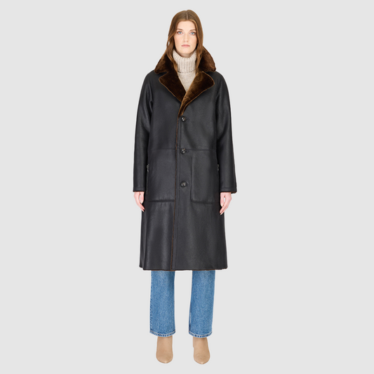 The ZIRA Coat is a heritage-inspired vintage reversible shearling jacket crafted in macassar nappa and iron wool. Designed to flip effortlessly from sleek nappa to plush iron wool teddy, it delivers versatile styling for both après-ski sophistication and everyday cold-weather elegance. Featuring a relaxed dropped shoulder, notch collar, and 3-button closure, ZIRA combines modern tailoring with timeless texture. Practical zip pockets on the nappa side and patch pockets on the teddy side, along with tie belt