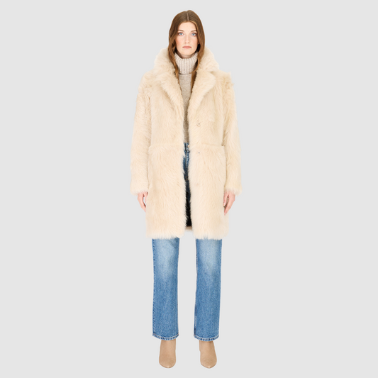 The CLOUD Jacket is a cozy, elevated outerwear essential crafted in Parchment Toscana wool-out mouton teddy. Designed with a regular shoulder and fitted torso, it provides a flattering silhouette while maintaining comfort across the shoulders. Functional slash side pockets and interior zip pockets keep essentials secure, while a front snap closure completes the clean, versatile design. CLOUD blends plush texture with modern tailoring for effortless cold weather style.