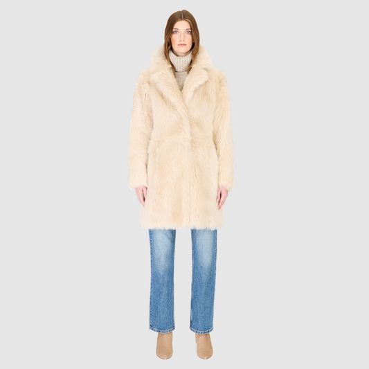The CLOUD Jacket is a cozy, elevated outerwear essential crafted in Parchment Toscana wool-out mouton teddy. Designed with a regular shoulder and fitted torso, it provides a flattering silhouette while maintaining comfort across the shoulders. Functional slash side pockets and interior zip pockets keep essentials secure, while a front snap closure completes the clean, versatile design. CLOUD blends plush texture with modern tailoring for effortless cold weather style.