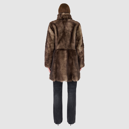 The CLOUD Jacket is a cozy, elevated outerwear essential crafted in Taupe Badger Toscana wool-out mouton teddy. Designed with a regular shoulder and fitted torso, it provides a flattering silhouette while maintaining comfort across the shoulders. Functional slash side pockets and interior zip pockets keep essentials secure, while a front snap closure completes the clean, versatile design. CLOUD blends plush texture with modern tailoring for effortless cold weather style.