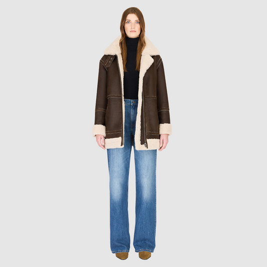 The DEZ Jacket is a heritage-inspired reversible medium-length shearling moto crafted in arabica suede&nbsp;leather with plush curly wool teddy on the reverse. Designed for a relaxed silhouette with drop shoulders, curly wool collar and trims, and a straight fit, DEZ combines modern edge with timeless texture. Functional patch pockets on both suede and wool sides and a front zip closure make this jacket as practical as it is versatile, perfect for après-ski layering or elevated city styling.
