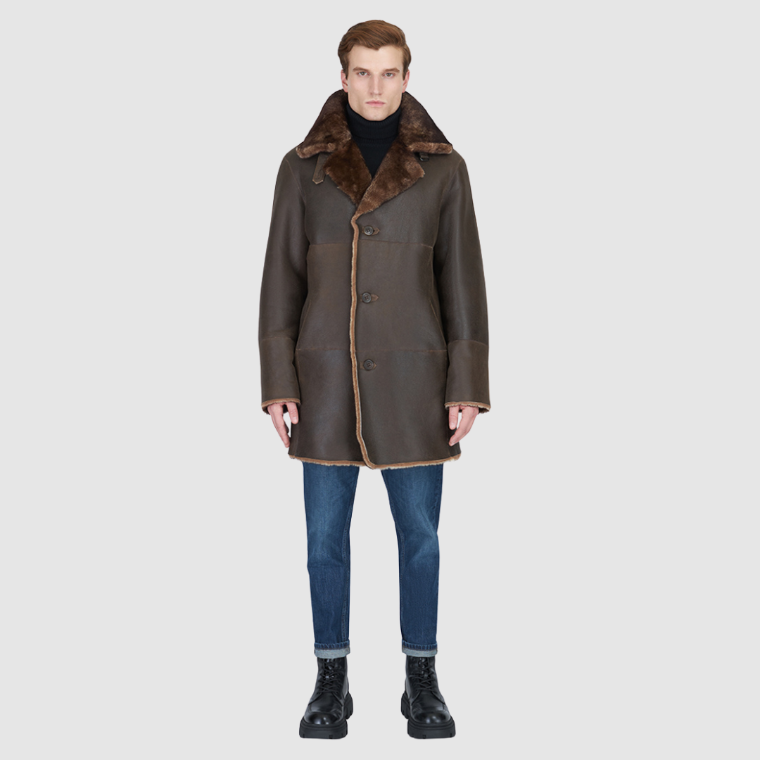 The Edson Burma Reversible Shearling Jacket is a mid-length men’s coat engineered for winter warmth and versatile styling. Crafted from luxe nappa with a plush ironed wool teddy reverse, it delivers two distinct silhouettes: structured and tailored when nappa-out, or relaxed and oversized when wool-out. Designed with a spread collar, raw edge detailing, and functional dual pockets, this jacket provides effortless layering and superior cold-weather protection. Edson balances timeless shearling craftsmanship 