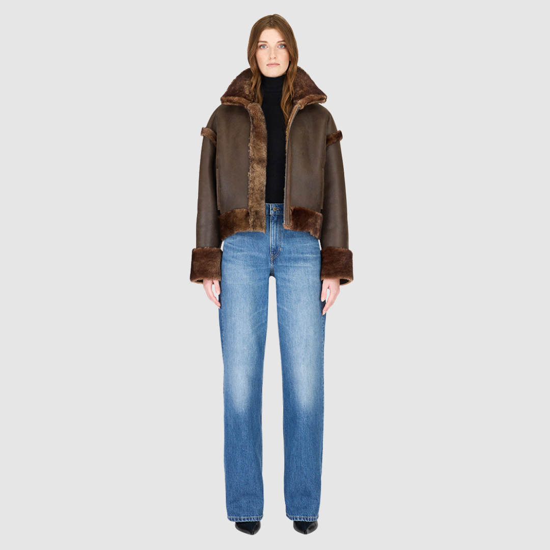 Reversible oversized cropped jacket curly wool and nappa combination Drop shoulder Tapered at hem Standard front zip closure Side and interior zip pockets