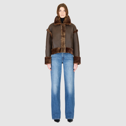 Reversible oversized cropped jacket curly wool and nappa combination Drop shoulder Tapered at hem Standard front zip closure Side and interior zip pockets