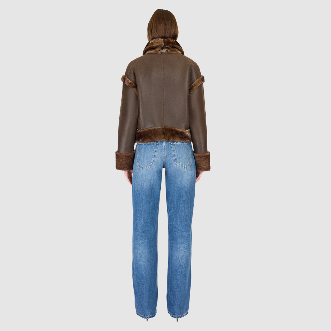 Reversible oversized cropped jacket curly wool and nappa combination Drop shoulder Tapered at hem Standard front zip closure Side and interior zip pockets