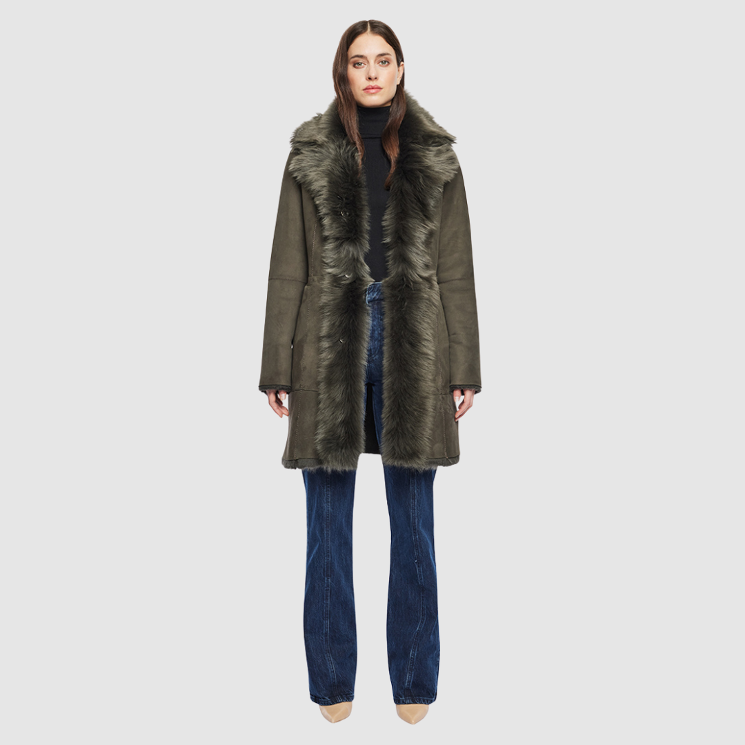 The GIPSI Reversible Shearling Jacket offers a modern take on the parka, combining rugged function with luxurious texture. Crafted in khaki suede that reverses to a plush Toscana wool teddy, it delivers two distinct looks in one. Designed with a regular shoulder and oversized Toscana notch collar, it balances structure with relaxed ease. Raw-edge hems and versatile pocketing lend utility to this semi-fitted style, making GIPSI ideal for heritage outerwear lovers and après-ski wardrobes alike.