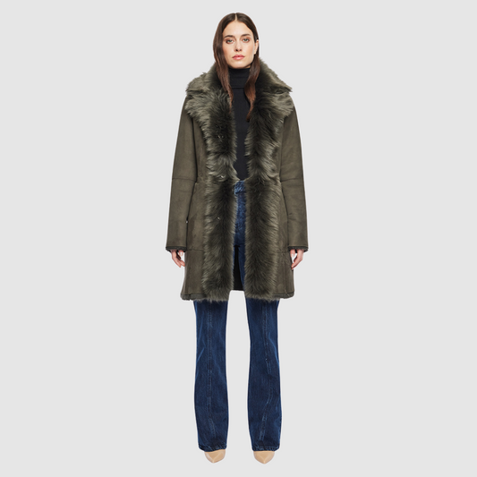 The GIPSI Reversible Shearling Jacket offers a modern take on the parka, combining rugged function with luxurious texture. Crafted in khaki suede that reverses to a plush Toscana wool teddy, it delivers two distinct looks in one. Designed with a regular shoulder and oversized Toscana notch collar, it balances structure with relaxed ease. Raw-edge hems and versatile pocketing lend utility to this semi-fitted style, making GIPSI ideal for heritage outerwear lovers and après-ski wardrobes alike.