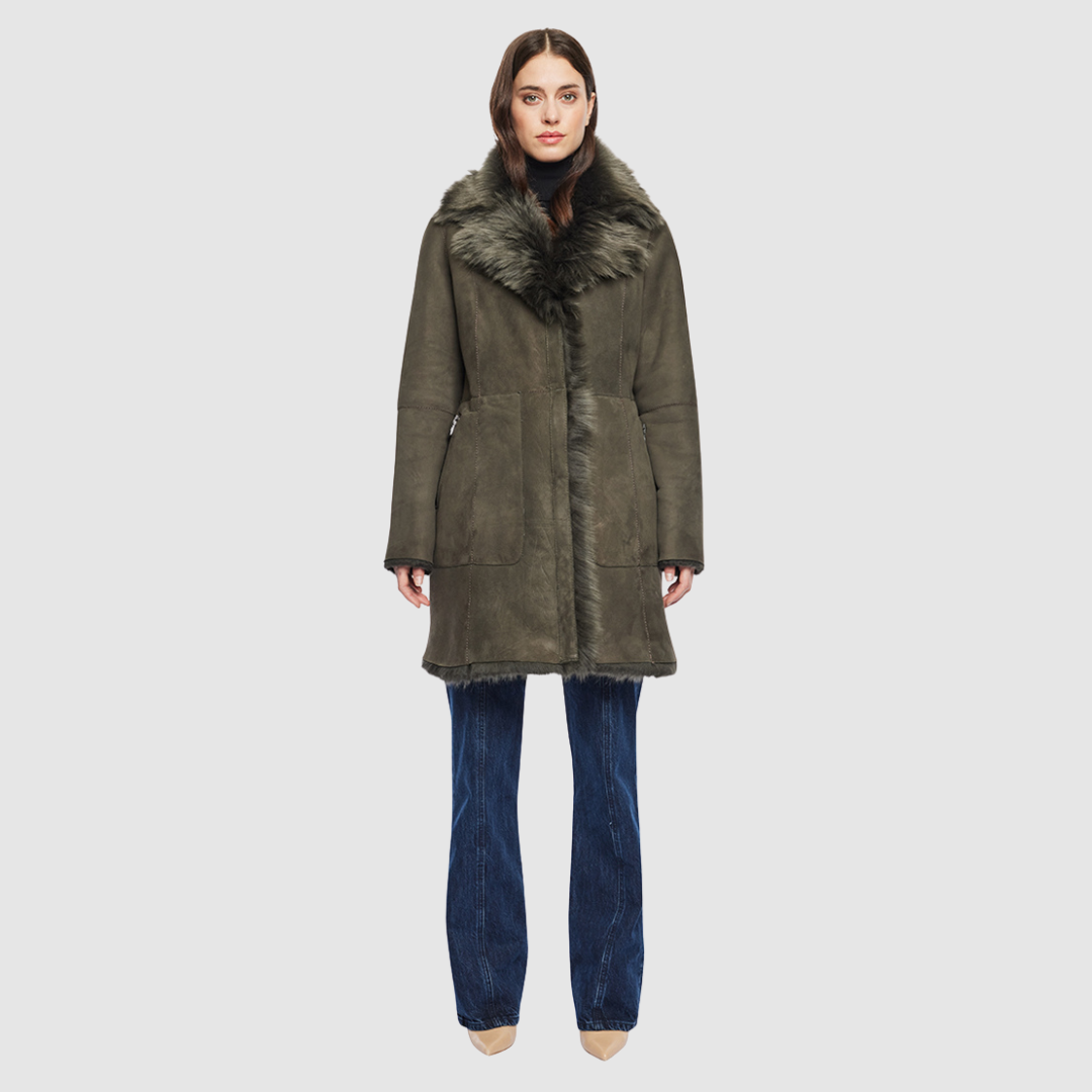 The GIPSI Reversible Shearling Jacket offers a modern take on the parka, combining rugged function with luxurious texture. Crafted in khaki suede that reverses to a plush Toscana wool teddy, it delivers two distinct looks in one. Designed with a regular shoulder and oversized Toscana notch collar, it balances structure with relaxed ease. Raw-edge hems and versatile pocketing lend utility to this semi-fitted style, making GIPSI ideal for heritage outerwear lovers and après-ski wardrobes alike.