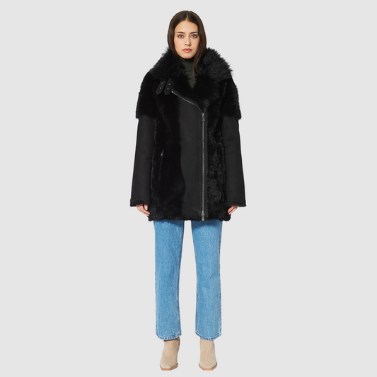 The HEART Shearling Jacket is a modern interpretation of classic shearling with a refined jet finish. Designed with timeless versatility, it balances luxury texture with everyday functionality. Its clean silhouette and plush construction make it an effortless statement piece for both heritage styling and après-ski wear.