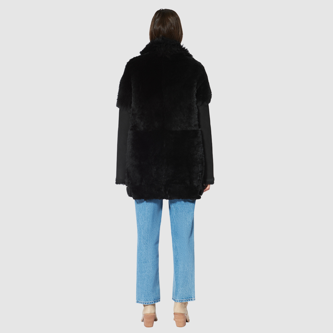 The HEART Shearling Jacket is a modern interpretation of classic shearling with a refined jet finish. Designed with timeless versatility, it balances luxury texture with everyday functionality. Its clean silhouette and plush construction make it an effortless statement piece for both heritage styling and après-ski wear.