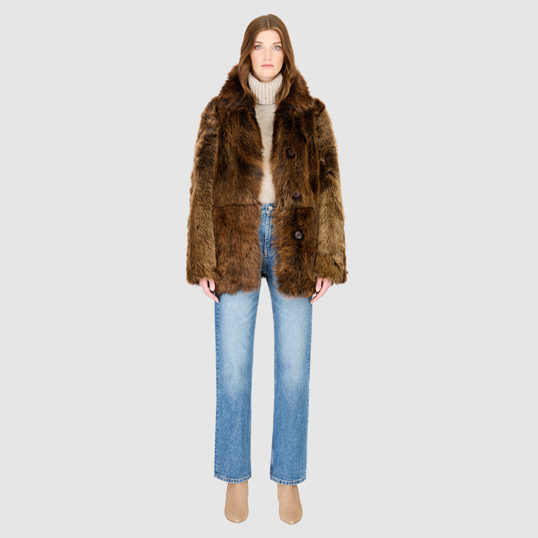 The MILKY WAY Jacket is a versatile statement piece crafted in macassar nappa shearling, designed as a reversible teddy that flips to a nappa skin-out jacket. It offers a relaxed fit when worn wool-out and a regular fit when worn skin-out. A spread collar adds structure, while slash side pockets on the teddy side and patch side pockets on the nappa side provide functionality. Finished with a front button closure, MILKY WAY combines plush texture with sleek nappa styling for modern cold-weather versatility.