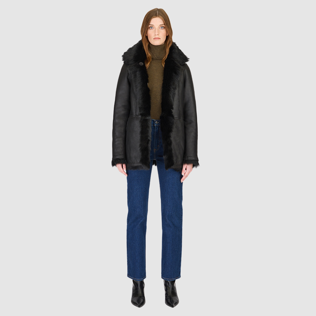 The MILKY WAY Jacket is a versatile statement piece crafted in Jet Toscana shearling, designed as a reversible teddy that flips to a nappa skin-out jacket. It offers a relaxed fit when worn wool-out and a regular fit when worn skin-out. A spread collar adds structure, while slash side pockets on the teddy side and patch side pockets on the nappa side provide functionality. Finished with a front button closure, MILKY WAY combines plush texture with sleek nappa styling for modern cold-weather versatility.