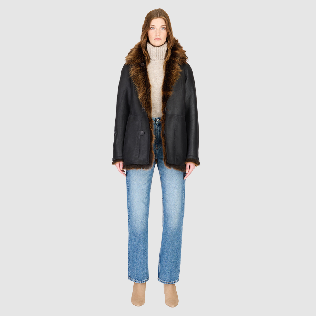 The MILKY WAY Jacket is a versatile statement piece crafted in macassar nappa shearling, designed as a reversible teddy that flips to a nappa skin-out jacket. It offers a relaxed fit when worn wool-out and a regular fit when worn skin-out. A spread collar adds structure, while slash side pockets on the teddy side and patch side pockets on the nappa side provide functionality. Finished with a front button closure, MILKY WAY combines plush texture with sleek nappa styling for modern cold-weather versatility.