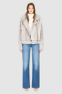 The SOUL Jacket is a heritage-inspired shearling moto crafted in suede and toscana rasado wool for a bold, modern edge. Its soft wool on a sleek suede body, drop shoulder, and sheared wool sleeves create a striking contrast of texture and silhouette. The Toscana long wool collar with double buckle detail, asymmetrical front zip closure, and functional side and interior zip pockets make SOUL both stylish and practical. Perfect for après-ski layering or elevated citywear.