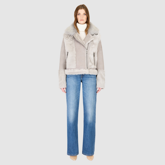 The SOUL Jacket is a heritage-inspired shearling moto crafted in suede and toscana rasado wool for a bold, modern edge. Its soft wool on a sleek suede body, drop shoulder, and sheared wool sleeves create a striking contrast of texture and silhouette. The Toscana long wool collar with double buckle detail, asymmetrical front zip closure, and functional side and interior zip pockets make SOUL both stylish and practical. Perfect for après-ski layering or elevated citywear.