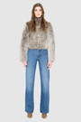 The SORA redefines urban luxury with an understated, sophisticated aesthetic tailored for the discerning eye. This exceptional statement piece features a plush toscana wool shearling that introduces a tactile dimension to cold-weather dressing. Fully lined for comfort, it provides an ultra-soft layer that glides on effortlessly while maintaining a structured, refined drape. Its clean collarless cropped silhouette flatters the form, shifting gracefully from casual street style to high-end evening wear. 