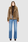 The SOUL Moto Shearling Coat brings together sleek nappa leather and plush shearling in a bold, urban-luxury design. Its drop-shoulder silhouette and sheared wool body create a modern fit, while the wool-out cuffs and toscana long wool collar with double buckle detail add dramatic texture. An asymmetrical front zip closure enhances its moto edge, balanced by functional side and interior zip pockets. Designed to be both striking and functional, SOUL is a contemporary classic for cold-weather styling.