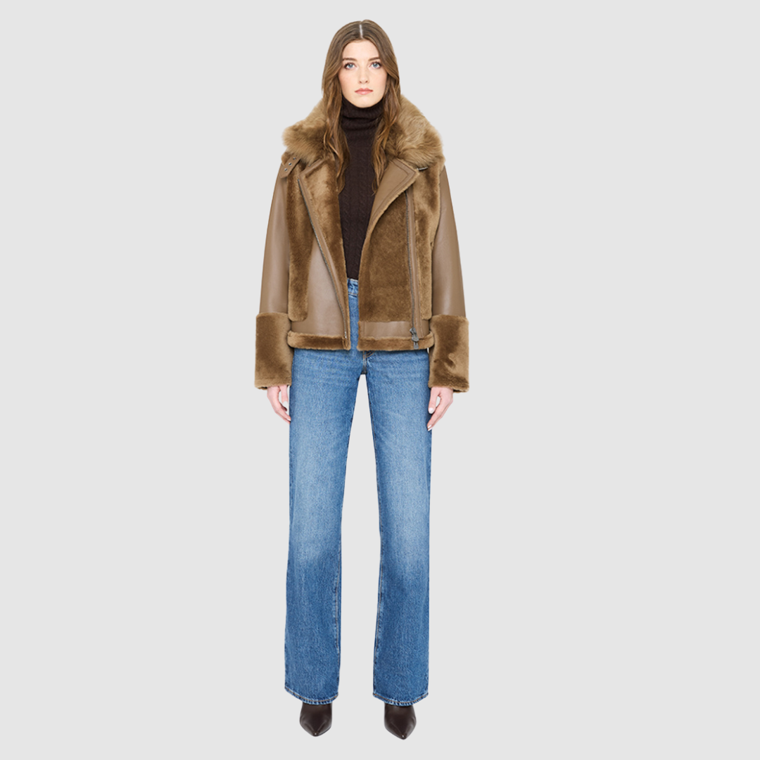 The SOUL Moto Shearling Coat brings together sleek nappa leather and plush shearling in a bold, urban-luxury design. Its drop-shoulder silhouette and sheared wool body create a modern fit, while the wool-out cuffs and toscana long wool collar with double buckle detail add dramatic texture. An asymmetrical front zip closure enhances its moto edge, balanced by functional side and interior zip pockets. Designed to be both striking and functional, SOUL is a contemporary classic for cold-weather styling.