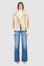 The SOUL Moto Shearling Coat brings together sleek suede leather and plush shearling in a bold, urban-luxury design. Its drop-shoulder silhouette and sheared wool body create a modern fit, while the wool-out cuffs and toscana long wool collar with double buckle detail add dramatic texture. An asymmetrical front zip closure enhances its moto edge, balanced by functional side and interior zip pockets. Designed to be both striking and functional, SOUL is a contemporary classic for cold-weather styling.