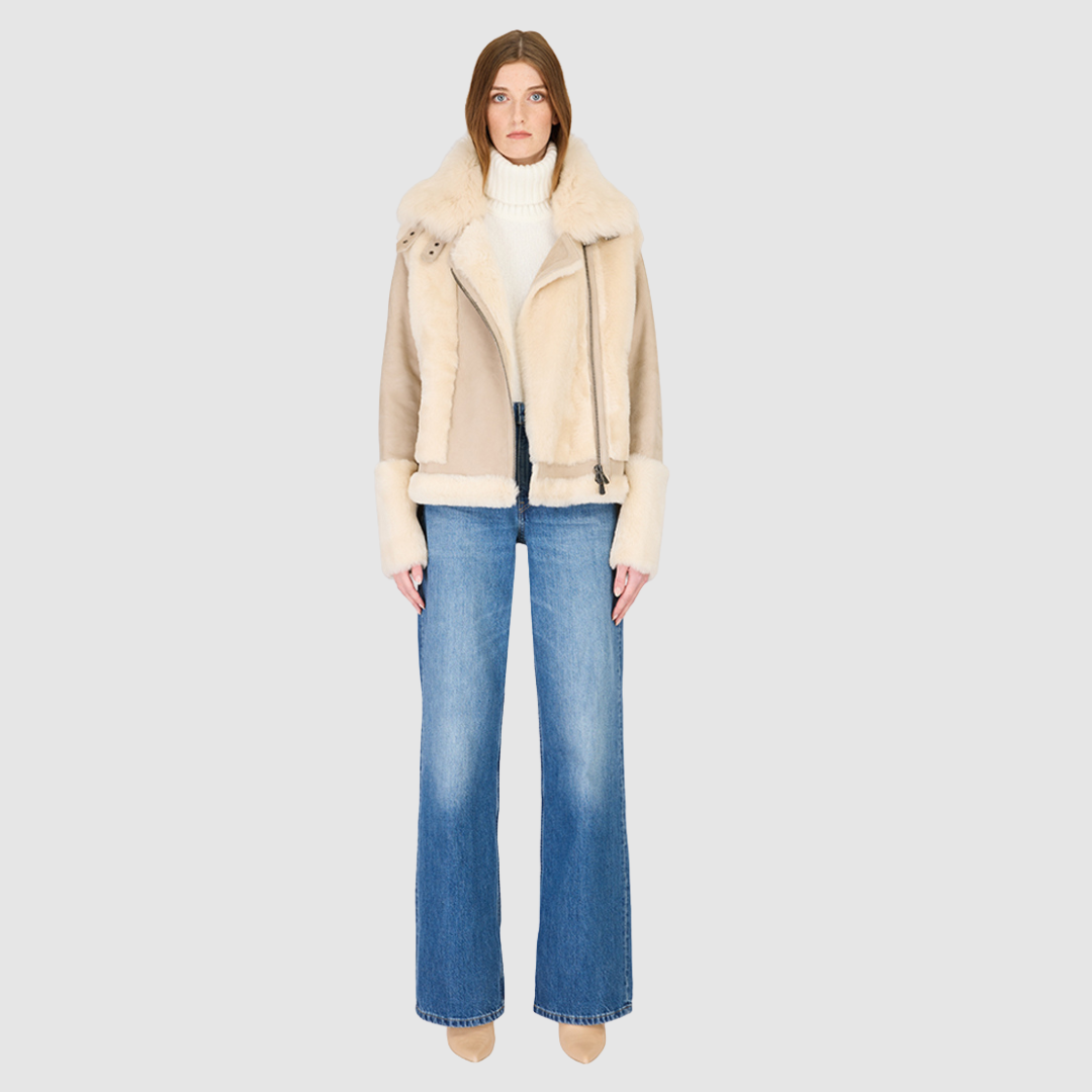 The SOUL Moto Shearling Coat brings together sleek suede leather and plush shearling in a bold, urban-luxury design. Its drop-shoulder silhouette and sheared wool body create a modern fit, while the wool-out cuffs and toscana long wool collar with double buckle detail add dramatic texture. An asymmetrical front zip closure enhances its moto edge, balanced by functional side and interior zip pockets. Designed to be both striking and functional, SOUL is a contemporary classic for cold-weather styling.