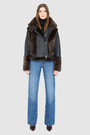 The SOUL Moto Shearling Coat brings together sleek nappa leather and plush shearling in a bold, urban-luxury design. Its drop-shoulder silhouette and sheared wool body create a modern fit, while the wool-out cuffs and toscana long wool collar with double buckle detail add dramatic texture. An asymmetrical front zip closure enhances its moto edge, balanced by functional side and interior zip pockets. Designed to be both striking and functional, SOUL is a contemporary classic for cold-weather styling.