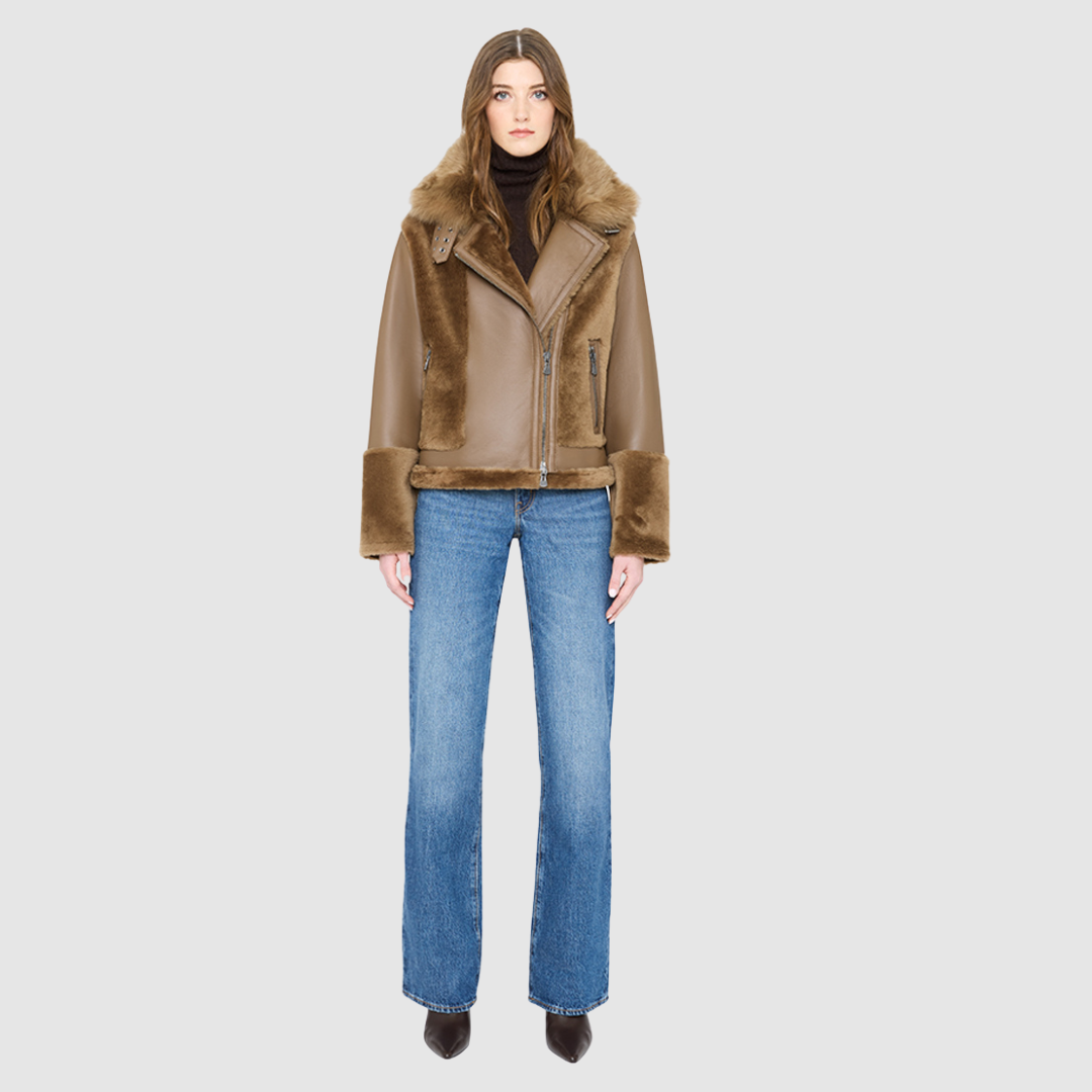 The SOUL Moto Shearling Coat brings together sleek nappa leather and plush shearling in a bold, urban-luxury design. Its drop-shoulder silhouette and sheared wool body create a modern fit, while the wool-out cuffs and toscana long wool collar with double buckle detail add dramatic texture. An asymmetrical front zip closure enhances its moto edge, balanced by functional side and interior zip pockets. Designed to be both striking and functional, SOUL is a contemporary classic for cold-weather styling.