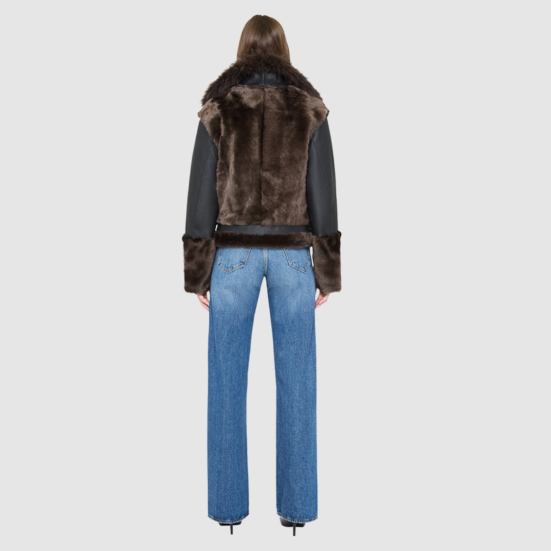 The SOUL Moto Shearling Coat brings together sleek nappa leather and plush shearling in a bold, urban-luxury design. Its drop-shoulder silhouette and sheared wool body create a modern fit, while the wool-out cuffs and toscana long wool collar with double buckle detail add dramatic texture. An asymmetrical front zip closure enhances its moto edge, balanced by functional side and interior zip pockets. Designed to be both striking and functional, SOUL is a contemporary classic for cold-weather styling.