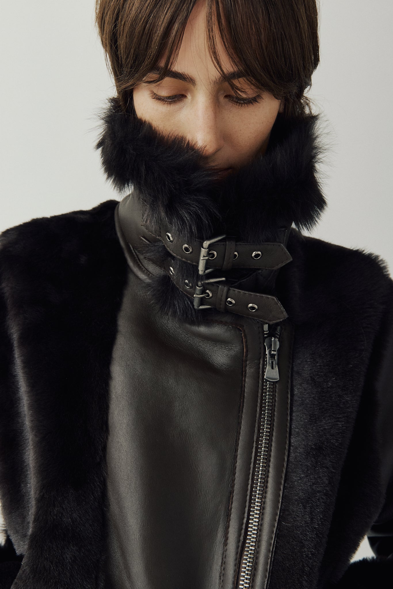 Soft wool on sleek nappa moto Drop shoulder Wool out cuff detail & sheared wool body and sleeves Toscana long wool collar with double buckle detail Asymmetrical front zip closure Side and interior zip pockets