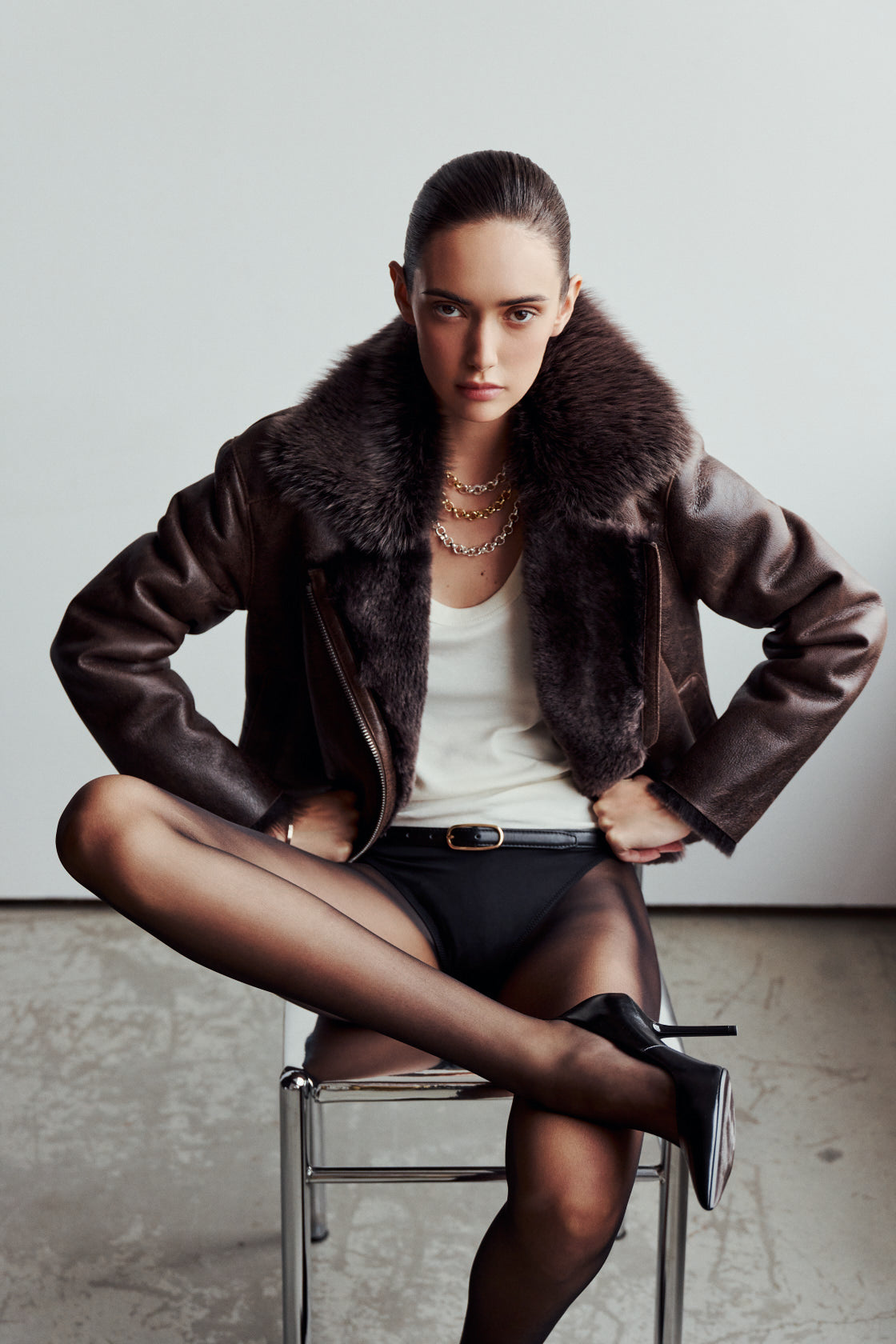 VRILL redefines alpine chic with a sharp, asymmetric profile tailored for effortless seasonal transitions. This cold-weather staple frames the body beautifully, pairing a refined matte nappa leather exterior with a uniform, plush ironed wool interior. Engineered for ultimate versatility across changing climates, the design transitions seamlessly from a classic skin-out moto jacket to a texture-forward statement piece complete with an exaggerated collar.
