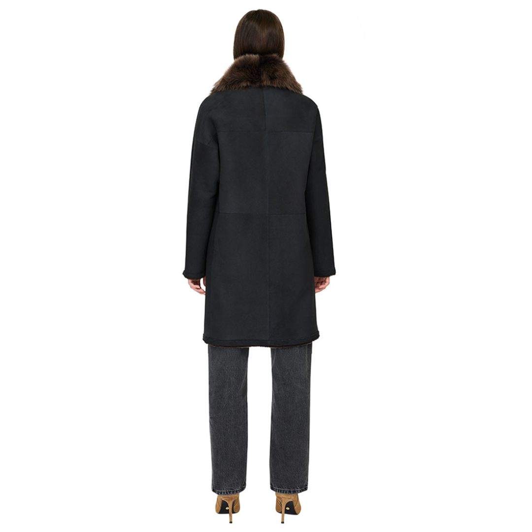 Reversible suede loose fitting coat Reverses to iron wool teddy Slight drop shoulder Double breasted button closure