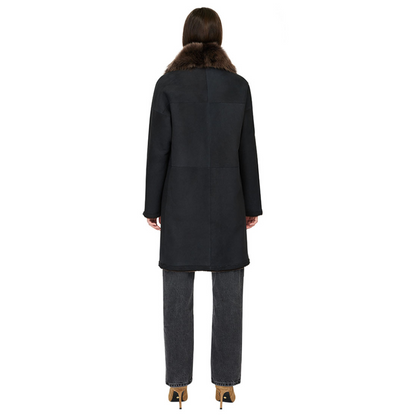 Reversible suede loose fitting coat Reverses to iron wool teddy Slight drop shoulder Double breasted button closure