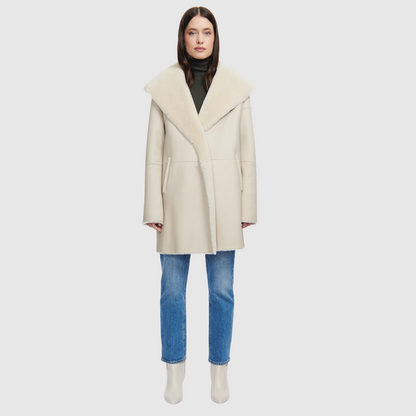 Reversible nappa oversized coat Reverses to ironed wool  Oversized hood, converts to shawl collar Raw edge finish Drop shoulder Pull through pockets