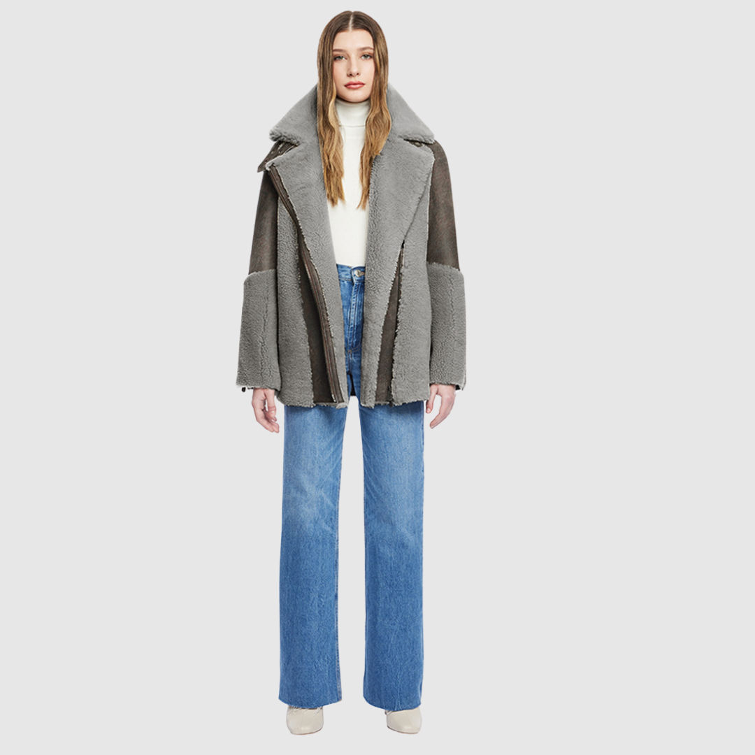 Curly wool and nappa mixed media coat Drop shoulder Oversized loose fitted style Curly wool detail on body and sleeve cuff Deep armhole and wide sleeves Straight fit Asymmetrical front zip closure Exterior zip pockets Hidden inside pockets