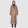 The DANIELLE Duster is a statement in heritage-inspired luxury and modern versatility. Crafted in taupe iron wool and plush iron wool shearling, this reversible oversized coat transitions effortlessly from sleek suede to cozy teddy texture. Its elongated silhouette is enhanced with a slight drop shoulder, back vent, and double-breasted button closure, creating timeless elegance with functional edge. Practical single welt pockets on the suede side and slash pockets on the wool side make DANIELLE a refined ch
