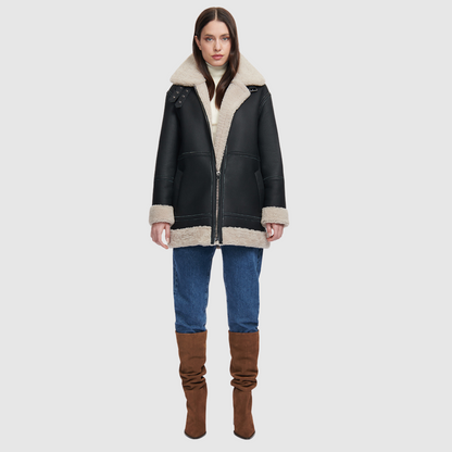 Nappa curly wool shearling Reversible relaxed medium length nappa moto Reverses to curly wool teddy  Drop shoulder Curly wool collar and trims Straight fit  Patch pockets on both skin-out and reversed wool-out sides Front zip closure 