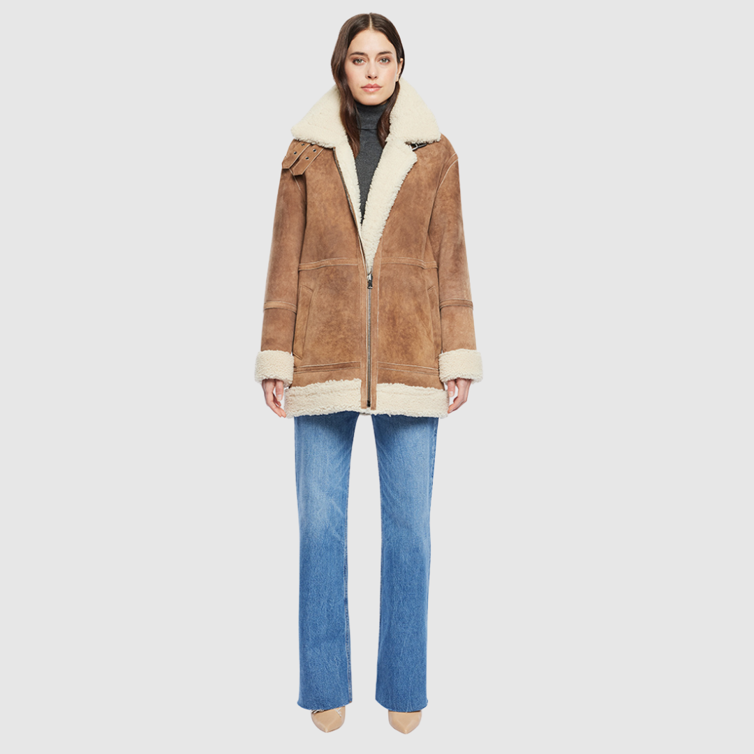 Vintage suede curly wool shearling Reversible relaxed medium length nappa moto Reverses to curly wool teddy  Drop shoulder Curly wool collar and trims Straight fit  Patch pockets on both skin-out and reversed wool-out sides Front zip closure