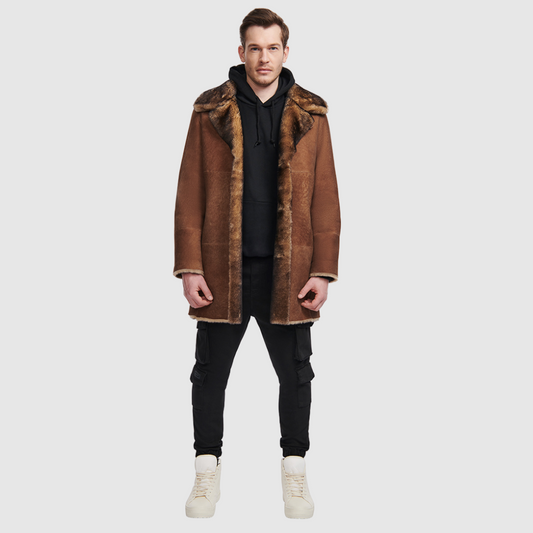  Reversible shearling suede medium length coat Reverses back to iron wool teddy Fits true to size when worn skin out Fits looser when worn wool out Raw edge finish Spread collar with tab Single welt side pocket on suede side Slash side pocket on iron wool side Single breasted button closure