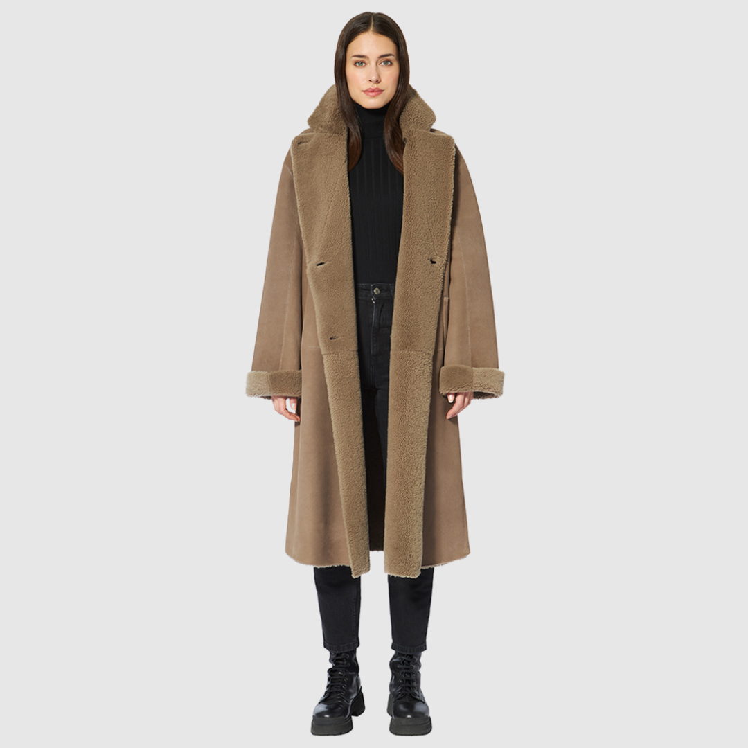 Reversible suede loose fitting coat Reverses to curly wool teddy Slight drop shoulder Double breasted button closure
